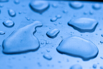 A blue surface with water droplets on it