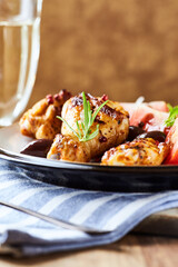 Grilled chicken pieces with fresh salad. Wooden background.	