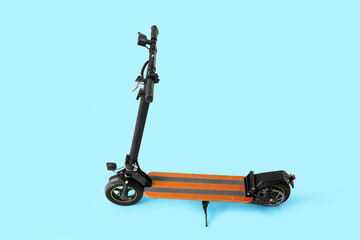 Modern electric kick scooter on blue background
