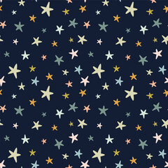 Cute seamless pattern with colorful stars on a blue background. Perfect for children's design.