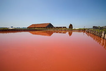 Selbstklebende Fototapeten landscape from Lake Atanasovsko Salt located near Burgas in Bulgaria Famous for its pink color, Desalination lake now used for treatments © czamfir
