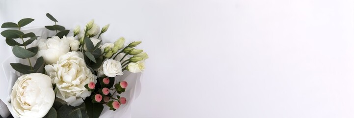 Elegant white flower bouquet with eucalyptus on plain background with space for text