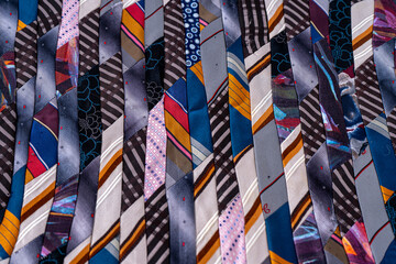 Patchwork background. A fragment of multi-colored pieces of fabric sewn together.