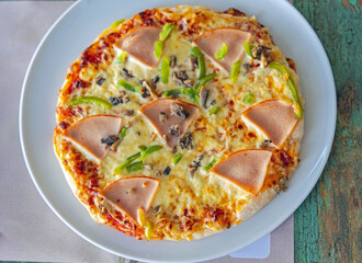 Gluten Free Pizza With Ham and Cheese at Plate Top View