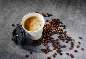 Coffee crema espresso in paper Coffee cup and bean on gray background, Top view of Espresso in  Takeaway paper coffee cup
