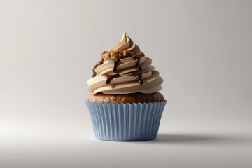 Delicious chocolate drizzled cupcake with creamy swirl icing in blue wrapper