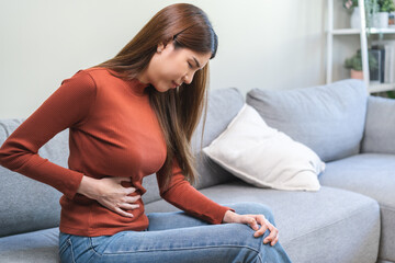 Flatulence ulcer, asian young woman, girl hands in belly, stomach pain from food poisoning, abdominal pain and digestive problem, gastritis or diarrhea. Abdomen inflammation, menstrual period people.