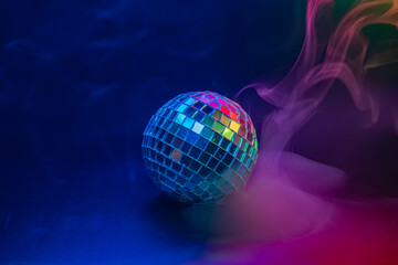 A vibrant, dreamy image with a disco ball and multi-colored bokeh lights, evoking feelings of excitement and celebration