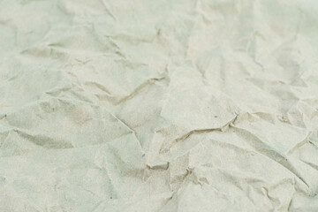 Obraz premium Image depicts a close-up of crumpled paper, symbolizing recycling, sustainability, eco-friendly packaging, waste transformation, and tactile experience