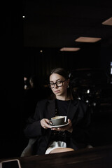 young woman drinking coffee in cafe