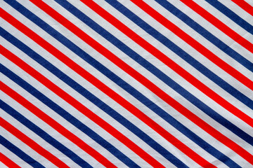 Top view. The fabric pattern is a diagonal stripe, alternating stripes of bright red, blue and white.