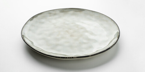 Empty gray textured plate on white background