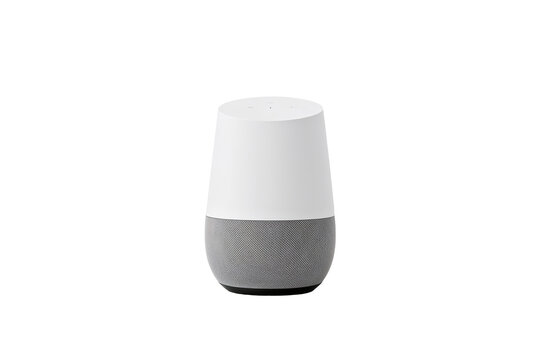 A google home smart speaker with a white top and gray bottom on a black background in a studio shot on transparent background
