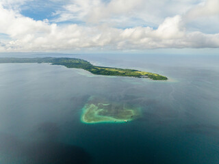 Scenic landscape of Island with turquoise sea water. Looc Fish Sanctuary. Tablas Island. Romblon, Philippines.