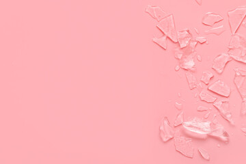 Pieces of frozen ice on pink background