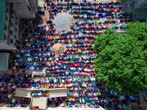 Aerial view of thousands of worshippers gather for Eid prayer in a vibrant display of faith and community at Dan Fodio Mosque in Unguwan Sunusi, Kaduna, Nigeria.