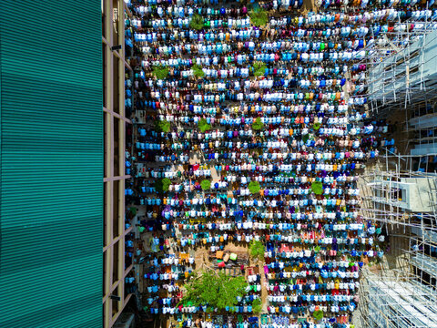 Aerial view of thousands of worshippers gather for Eid prayer in a vibrant display of faith and community at Dan Fodio Mosque in Unguwan Sunusi, Kaduna, Nigeria.