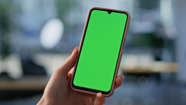 Fototapeta Freelancer watching mockup cellphone sitting workplace closeup. Unknown woman 