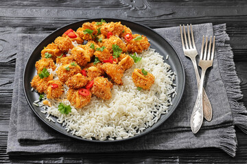 panko-breaded chicken bites with rice and sauce