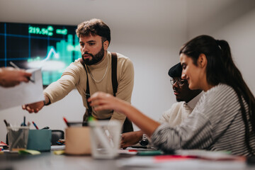 A group of colleagues actively discussing ideas in a business meeting with visual data projections. The environment emphasizes teamwork, strategy, and productivity in a professional setting.