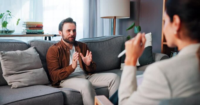 Therapy, happy and man with therapist on sofa for counseling session, support and consulting. Psychology, office and person listen to patient with feedback for mental health tips, treatment and help - Powered by Adobe