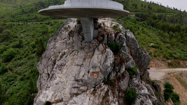 Up and over Aerial shot of the Miradouro do Zebro with the drone flying diagonaly up and over the viewing point.