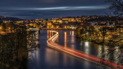Obraz premium City lights reflecting on a river at night