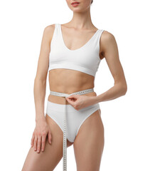 Woman with slim body and measuring tape on white background, closeup