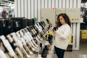 Woman Shopping for Electronics in a Retail Store