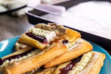 Puff pastry tarts with cream cheese, cherry jam, peanut butter. Dessert. pastry