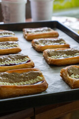 Puff pastry tarts with cream cheese, cherry jam, peanut butter. Dessert. pastry