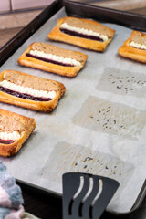 Puff pastry tarts with cream cheese, cherry jam, peanut butter. Dessert. pastry
