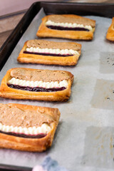 Puff pastry tarts with cream cheese, cherry jam, peanut butter. Dessert. pastry