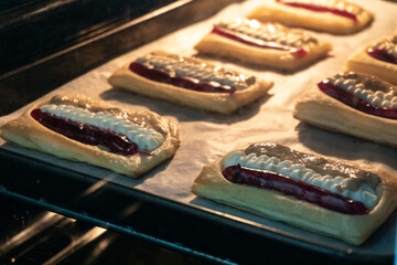 Puff pastry tarts with cream cheese, cherry jam, peanut butter. Dessert. pastry