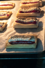 Puff pastry tarts with cream cheese, cherry jam, peanut butter. Dessert. pastry