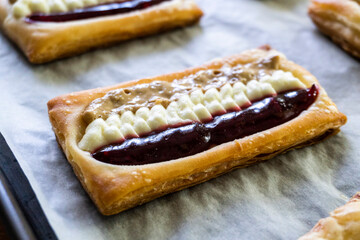 Puff pastry tarts with cream cheese, cherry jam, peanut butter. Dessert. pastry