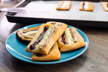 Puff pastry tarts with cream cheese, cherry jam, peanut butter. Dessert. pastry