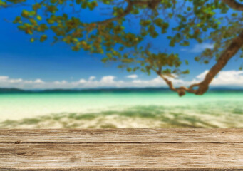 Wooden table top on the beach or sea.Party on the beach  sunshine time concept.For montage product display or design key visual layout.View of copy space.