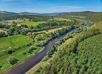aerial view of the forest and pasture landscape at Spey River in eastern Scotland, UK
