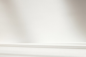 Abstract white studio background with shadows of window. Empty 3d room. Display product with blurred backdrop.