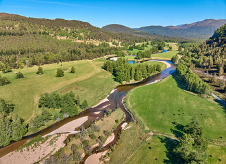 aerial view of the course of Clunie River near Braemar in the Cairn Gorms national Park, Scotland,...