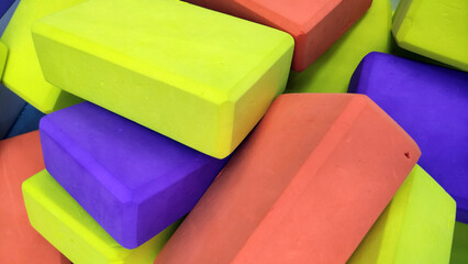 Colorful Foam Blocks in Pile – Bright Red, Yellow, and Purple