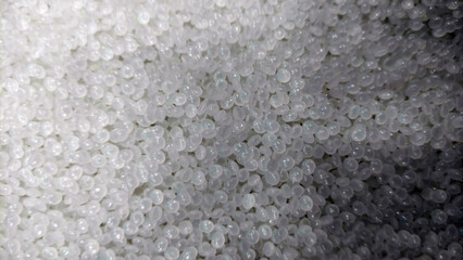 Close-Up of Clear Plastic Pellets – Raw Polymer Granules for Industrial Use