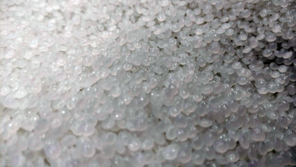 Close-Up of Clear Plastic Pellets – Raw Polymer Granules for Industrial Use