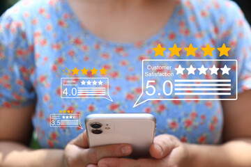 A person holding a smartphone with floating icons of five-star ratings and customer reviews, symbolizing positive feedback, user satisfaction, and digital engagement through mobile platforms.