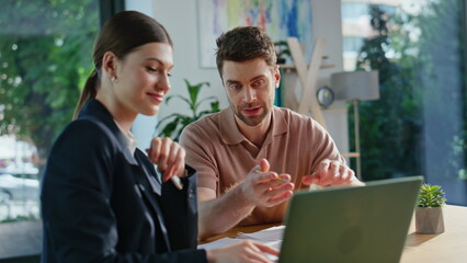 Consultant advising investment project to man showing laptop at office closeup.