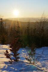 Sun set at Silesian Beskid near Bialy Krzyz in Poland - vertical