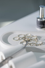 Elegant close-up of manicure tools on light surface, professional beauty salon concept