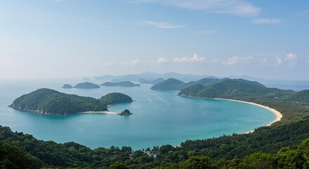 Scenic aerial view of a tropical bay with islands, crystal clear water, and lush greenery