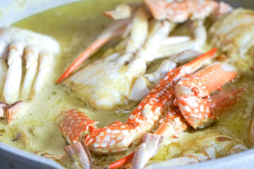 Close up of crab cooked in spicy coconut milk or Ketam Masak Lemak Cili Api.